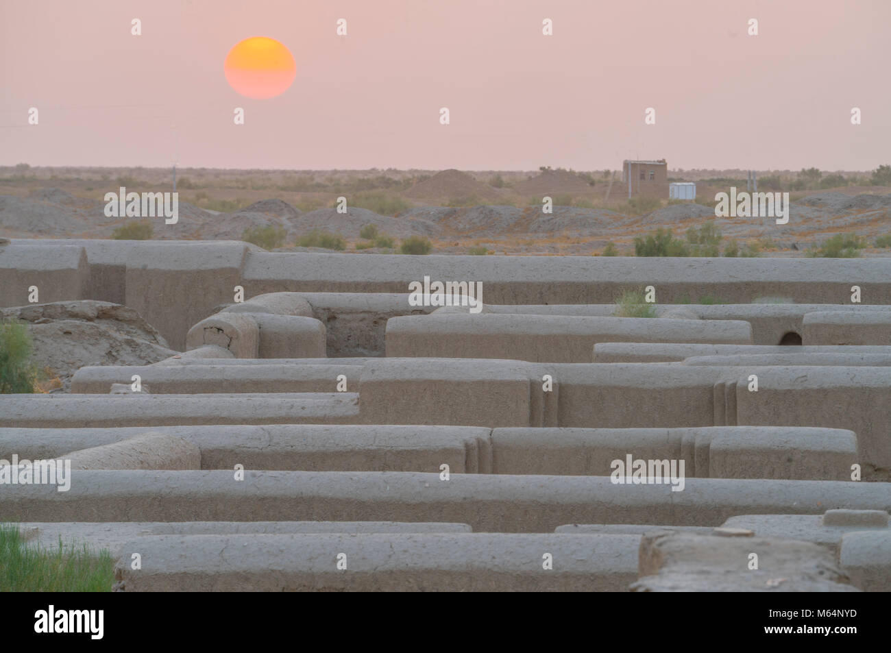 Sunset over restored walls of Gonur Depe, Turkmenistan, Huge site used by Bronze Age people 2500 bc Stock Photo