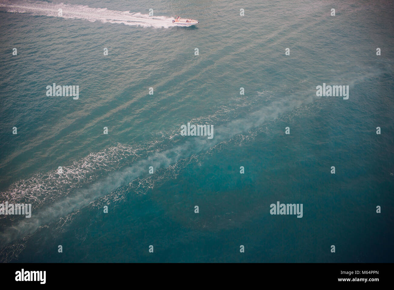 Top view of a boat sailing in the blue sea Stock Photo - Alamy