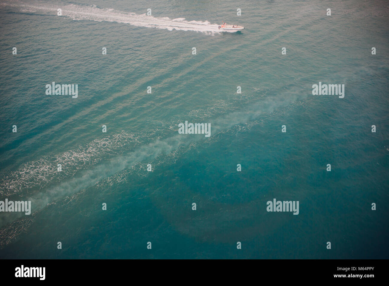 Top view of a boat sailing in the blue sea Stock Photo - Alamy