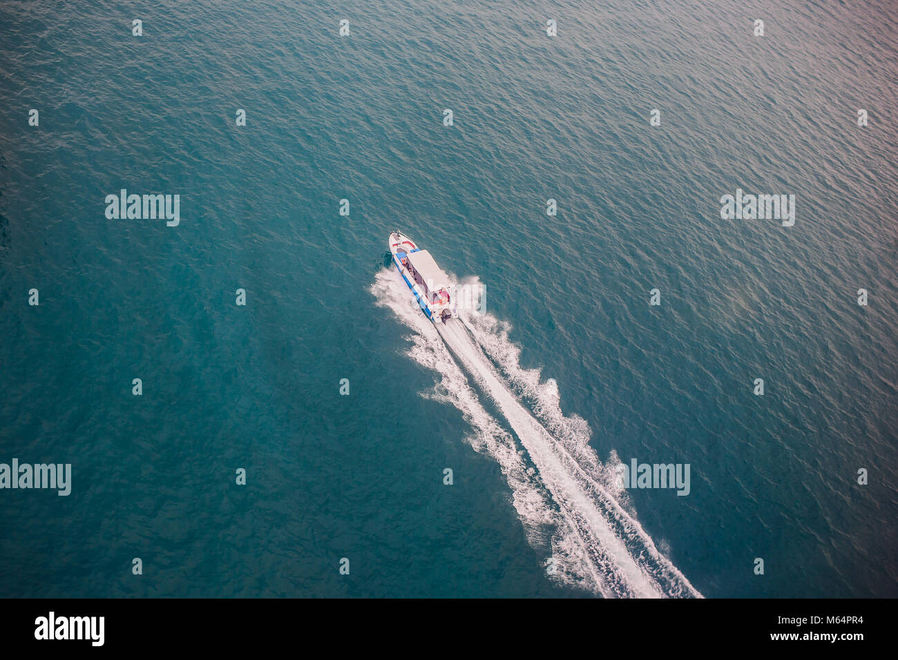 Top view of a boat sailing in the blue sea Stock Photo - Alamy