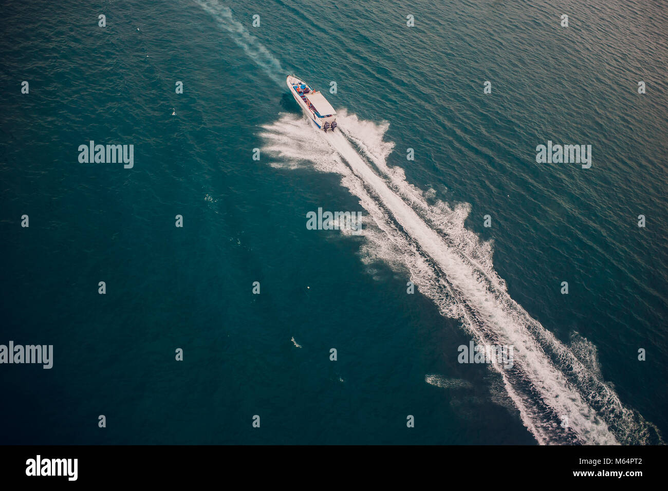 Top view of a boat sailing in the blue sea Stock Photo - Alamy