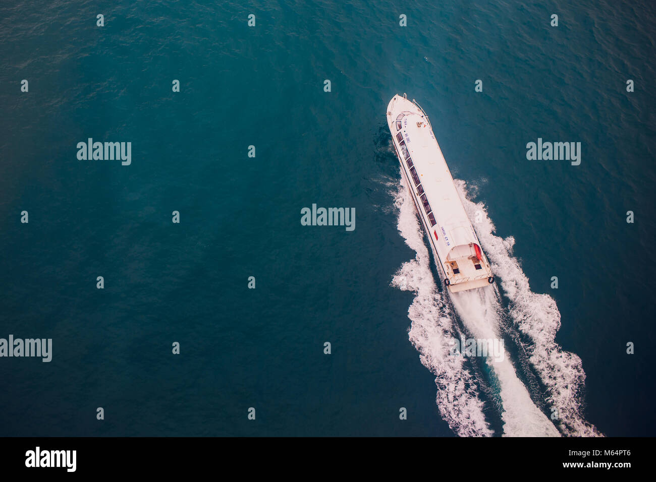 Top view of a boat sailing in the blue sea Stock Photo - Alamy