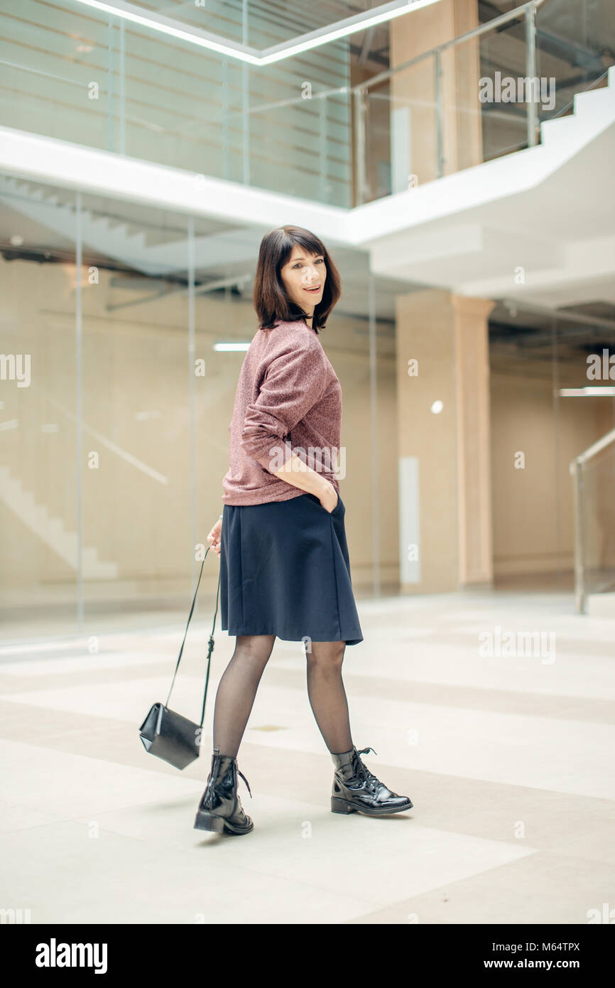 Mature woman walking hi-res stock photography and images - Alamy