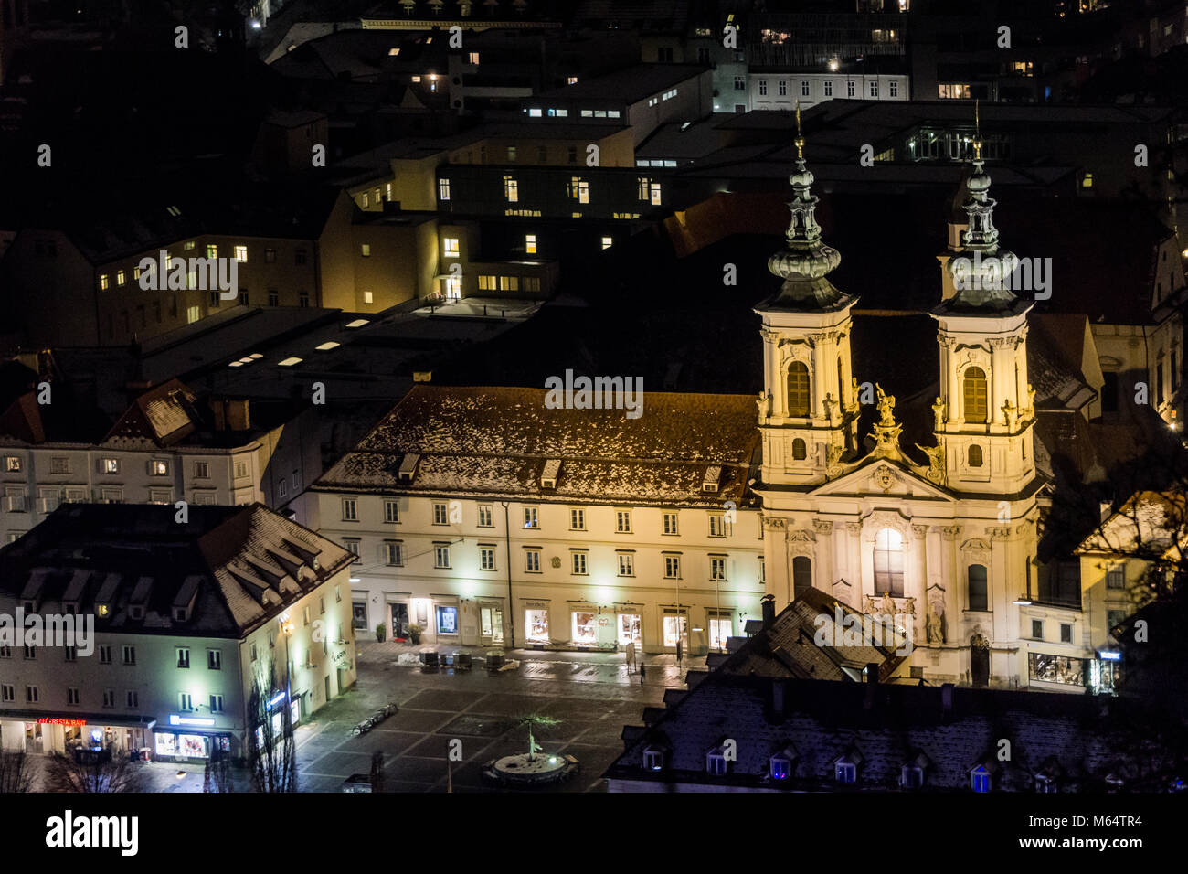 Graz, Austria - 08.02.2018: Floodlights illuminate the Mariahilfe church on a cold, winter night Stock Photo
