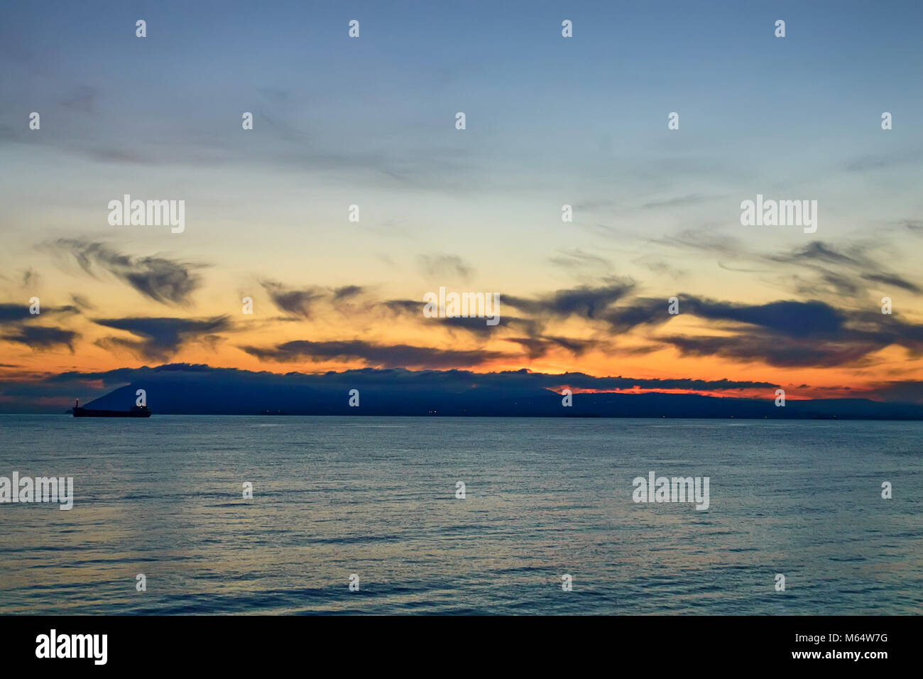 Beautiful natural sunset over sea Stock Photo - Alamy