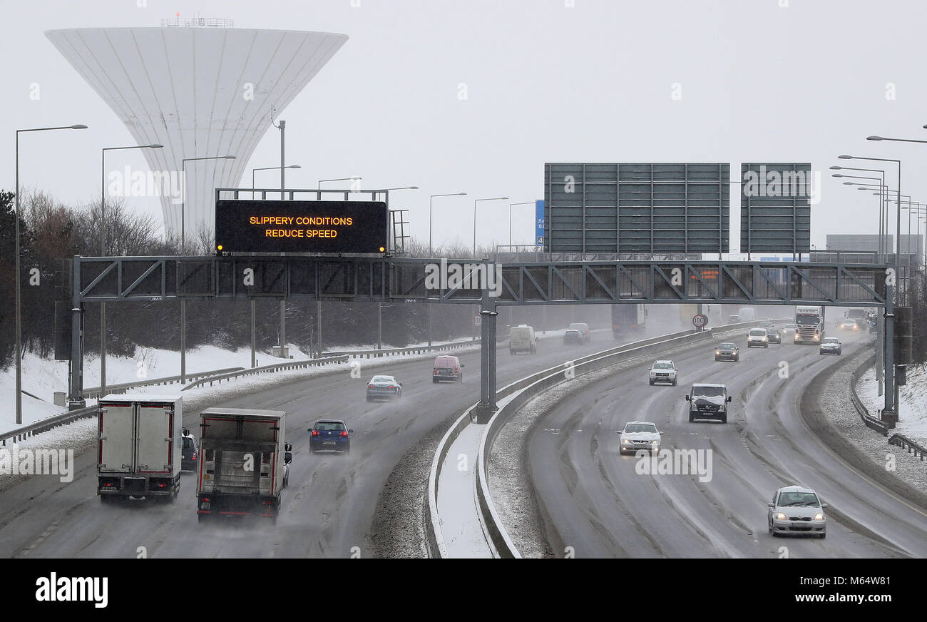 A sign warning of slippery conditions on the M50 in Dublin, as heavy snow has caused more misery for travellers overnight. Picture date: Wednesday February 28, 2018. See PA story WEATHER Snow. Photo credit should read: Brian Lawless/PA Wire Stock Photo