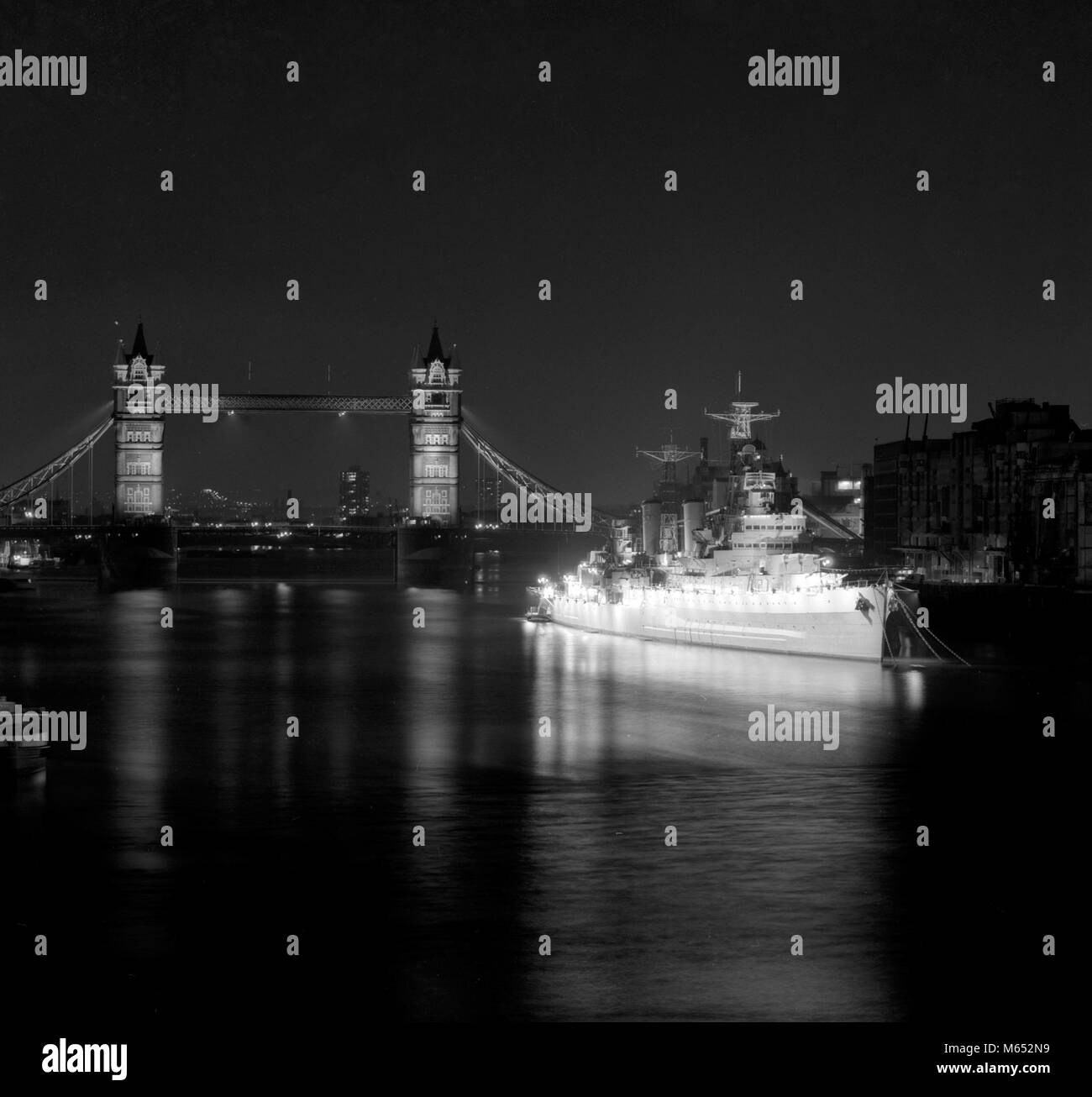 HMS Belfast, the veteran World War II cruiser moored in the Thames, near Tower Bridge, is now floodlit. A new floodlighting system donated by Philips Electrical Limited was officially switched on last night by Reg Prentice, Secretary of State for Education and Science, to form part of the European Architectural Heritage Year. Stock Photo