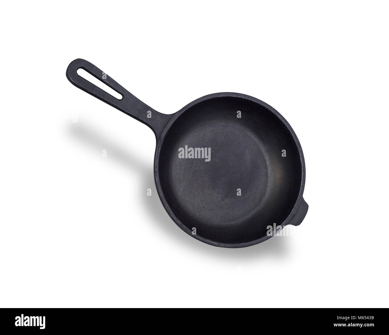 round black castiron frying pan with handle isolated on white background Stock Photo Alamy