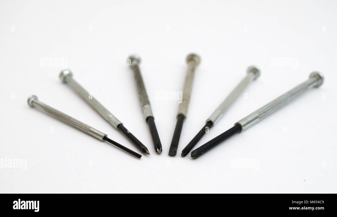 Screwdriver Form Six screwdrivers rigged in some form on a white background Stock Photo ...