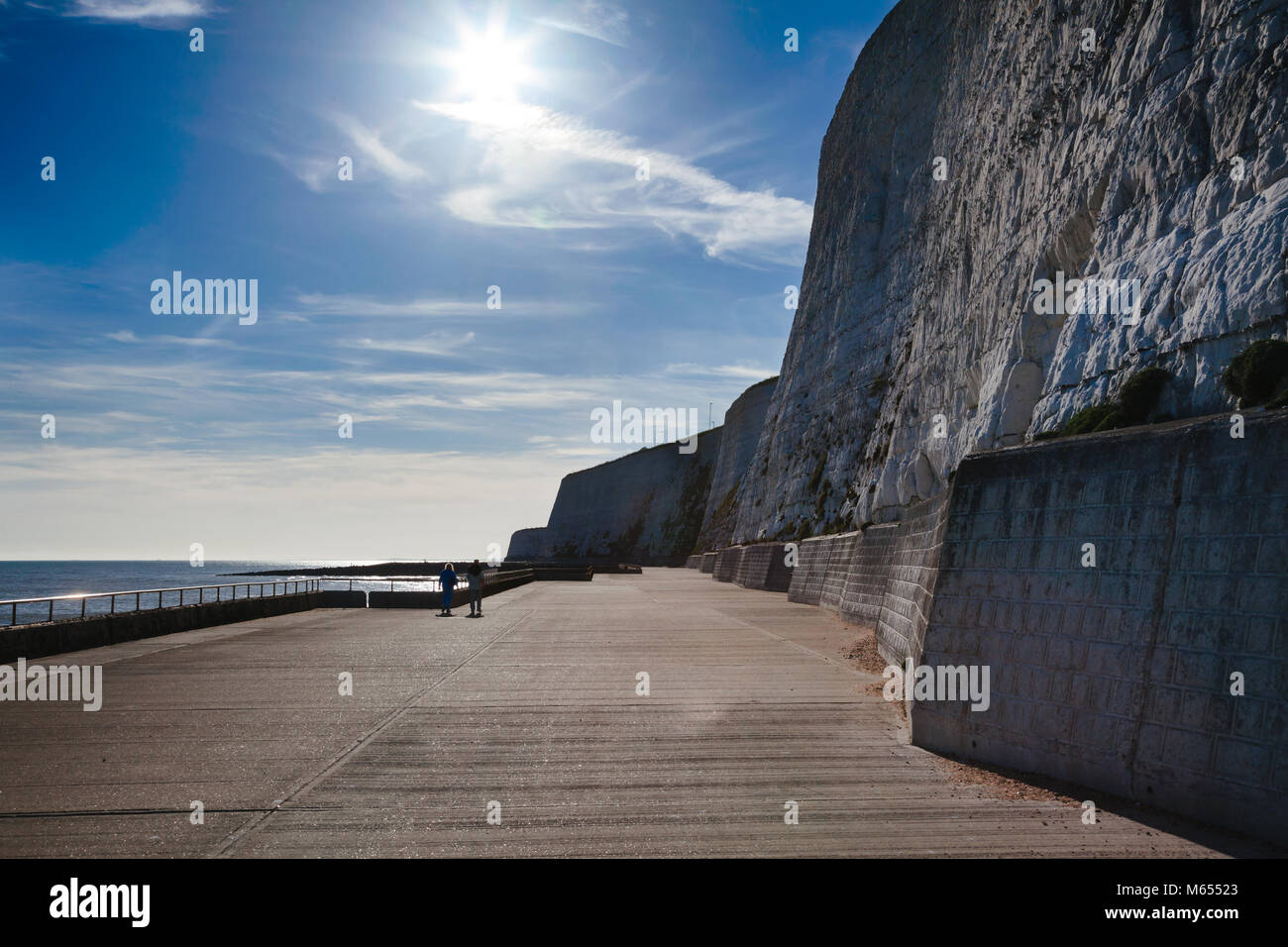Undercliff Walk path for walkers and cyclists at the foot of protected white chalk cliffs near Brighton in East Sussex on the south coast of England,  Stock Photo