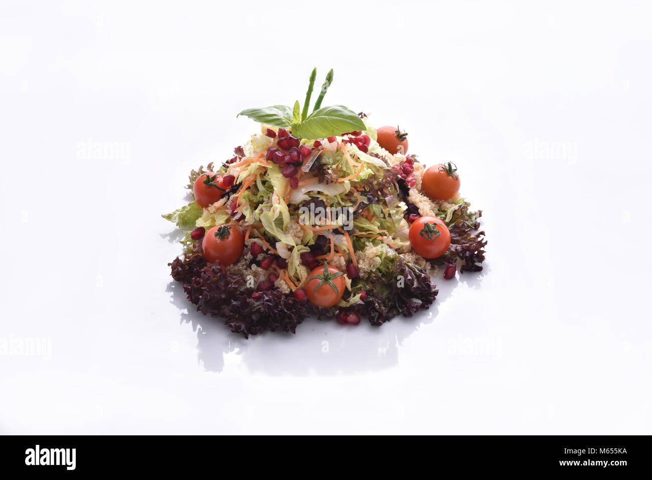 Quinoa salad with mixed vegetables and pomegranate Stock Photo