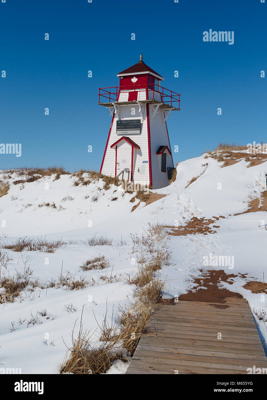 Covehead lighthouse nestled into the sand dunes in rural Prince Edward Island, Canada. Stock Photo