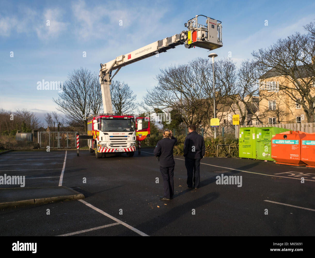 Fire appliance training using a Magirus extending platform fire appliance for evaluating multi-story buildings Stock Photo