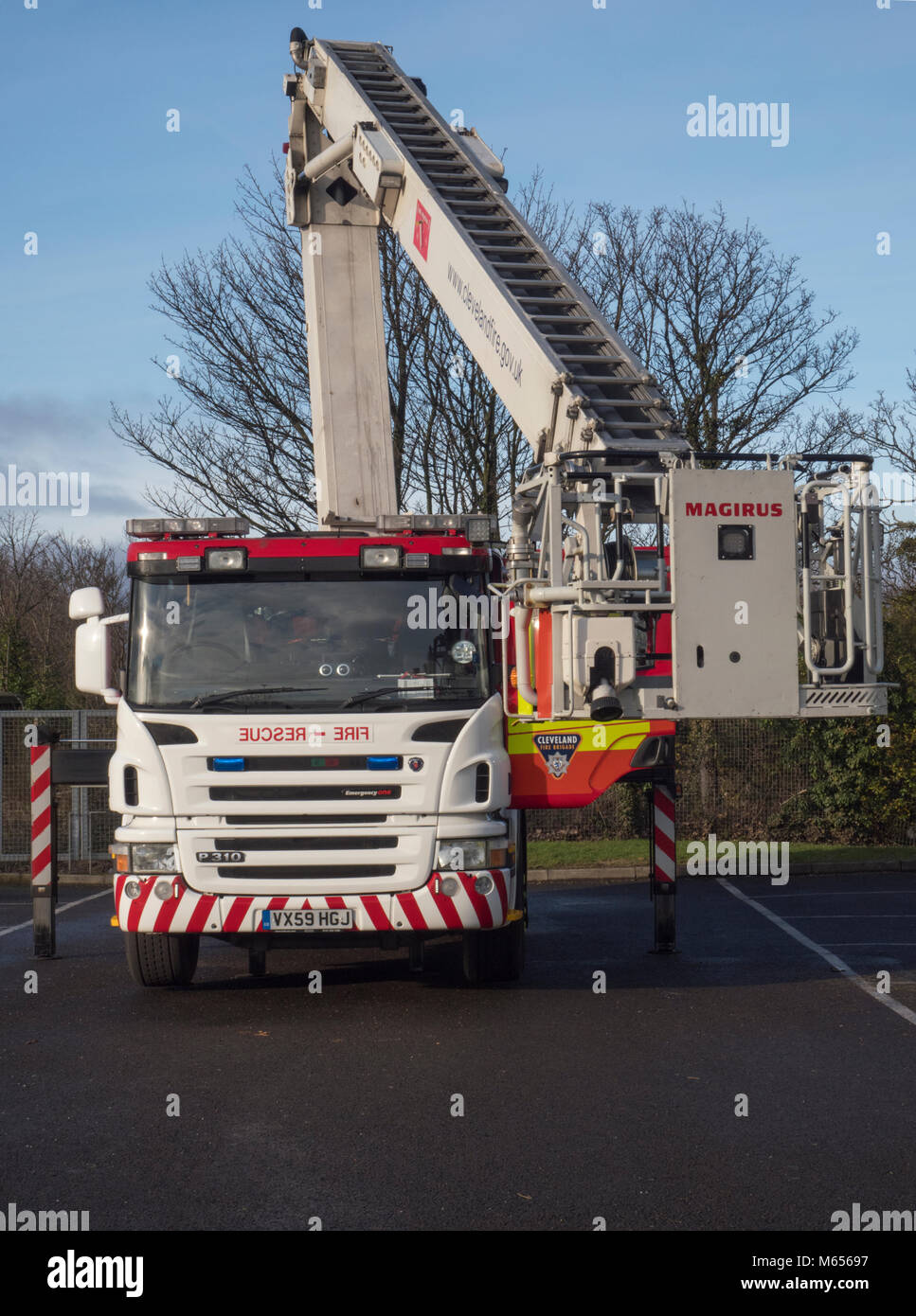Fire appliance training using a Magirus extending platform fire appliance for evaluating multi-story buildings Stock Photo