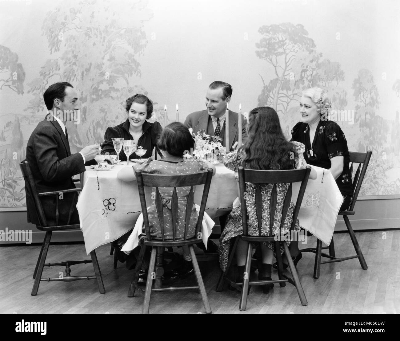 1930s Three Generation Family Men Women Children Dining At Table
