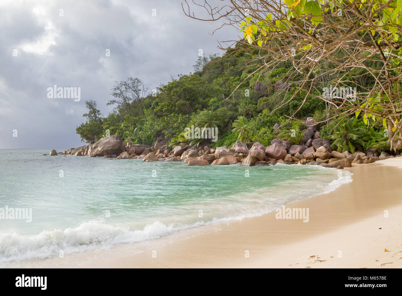 Tropical beach and turqouise water on Praslin, Seychelles. Stock Photo