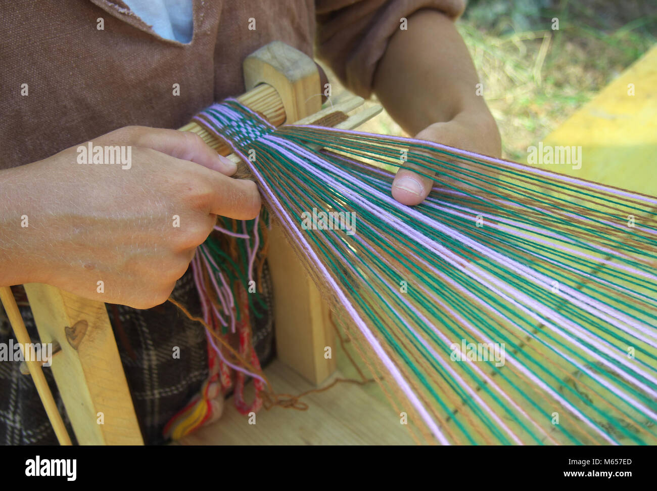 The process of making woven belt of linen yarn Stock Photo Alamy