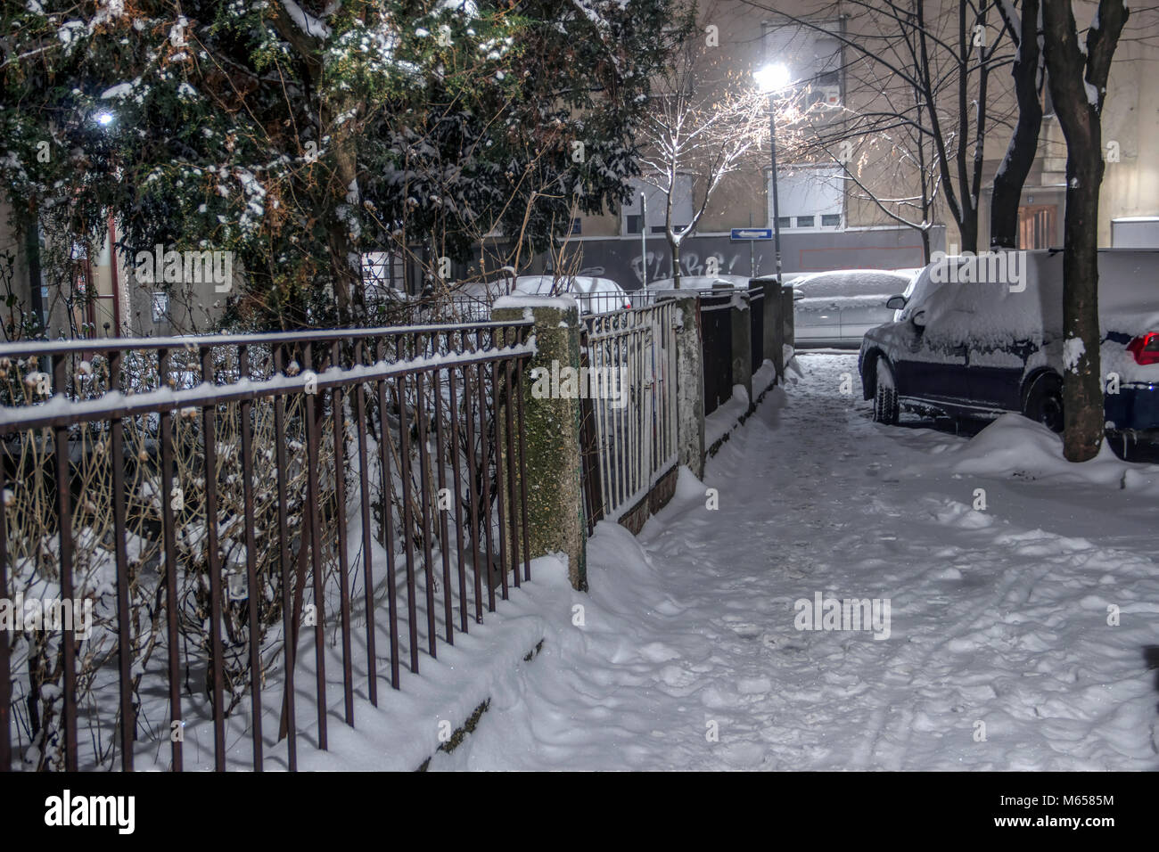 ZEMUN, BELGRADE, SERBIA, FEBRUARY 2018 - Snow covered street in a residential area at night Stock Photo