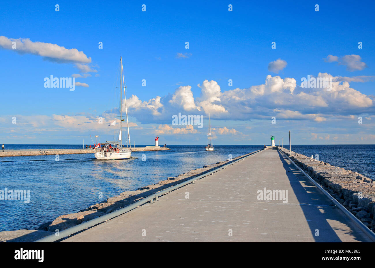 Sailboats leaving Frenchman's Bay and enteing Lake Ontario, in Pickering, Ontario, Canada Stock Photo