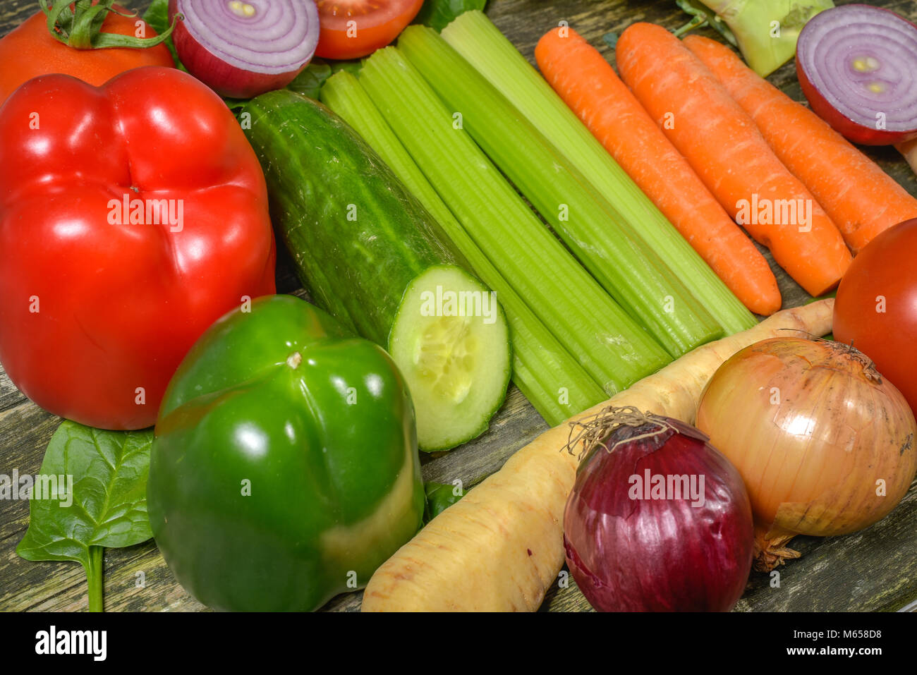 Colorful fresh group of vegetables for a balanced diet. Wooden ...