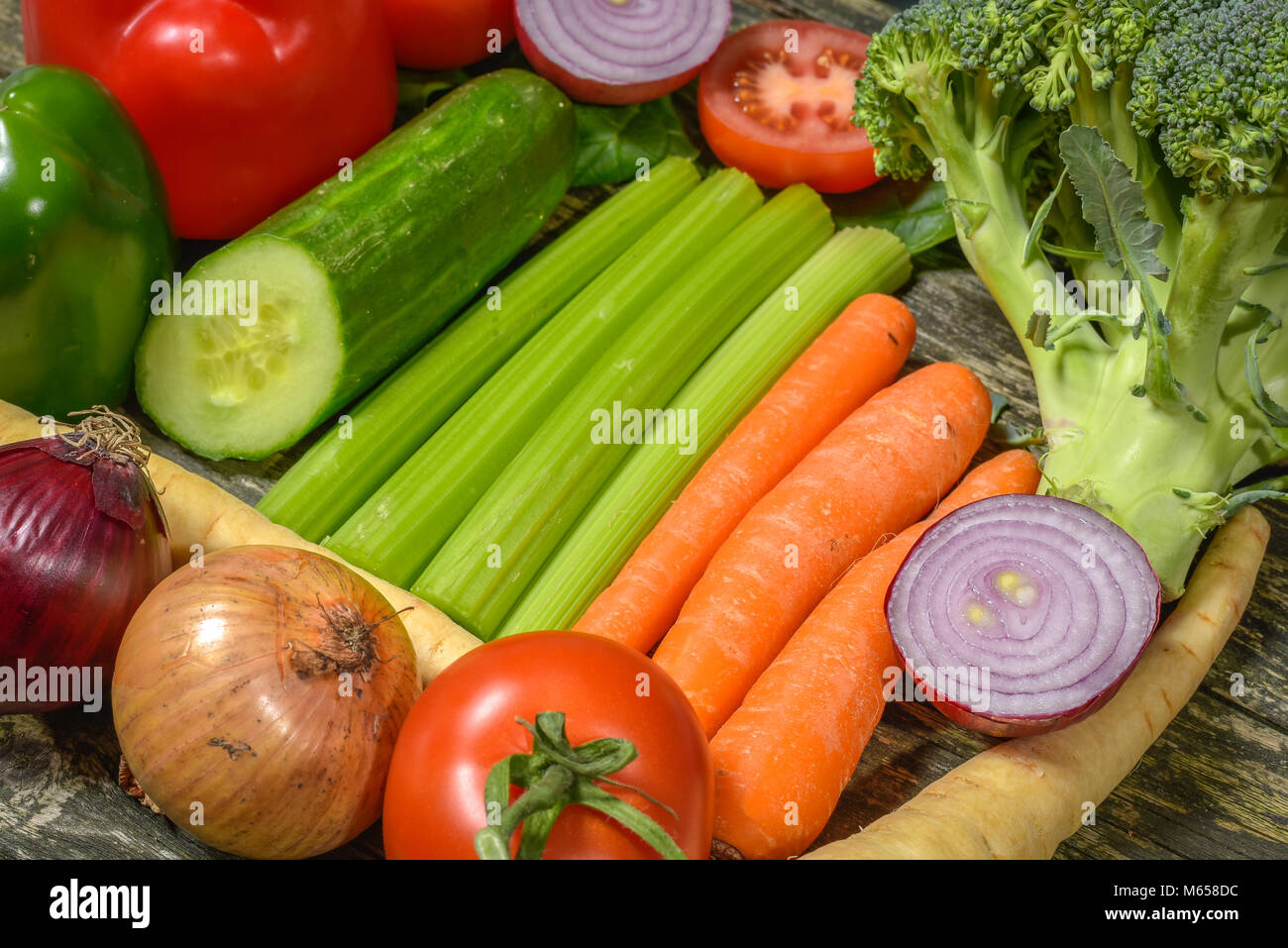Colorful fresh group of vegetables for a balanced diet. Wooden ...