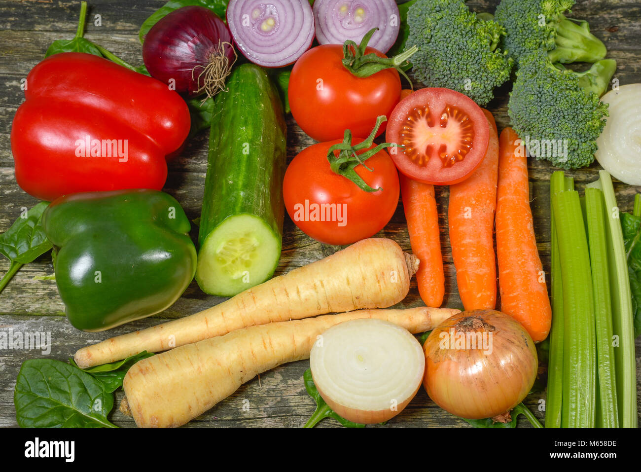 Colorful fresh group of vegetables for a balanced diet. Wooden ...
