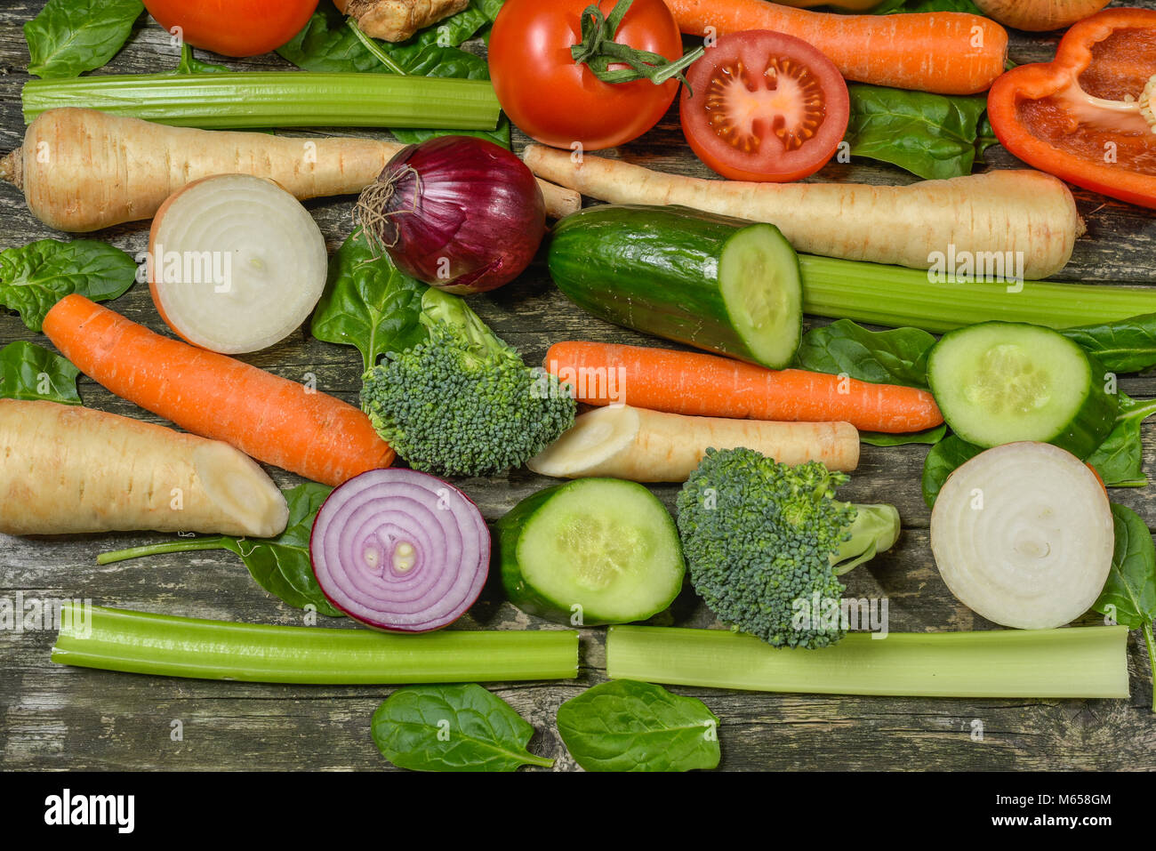 Colorful fresh group of vegetables for a balanced diet. Wooden ...