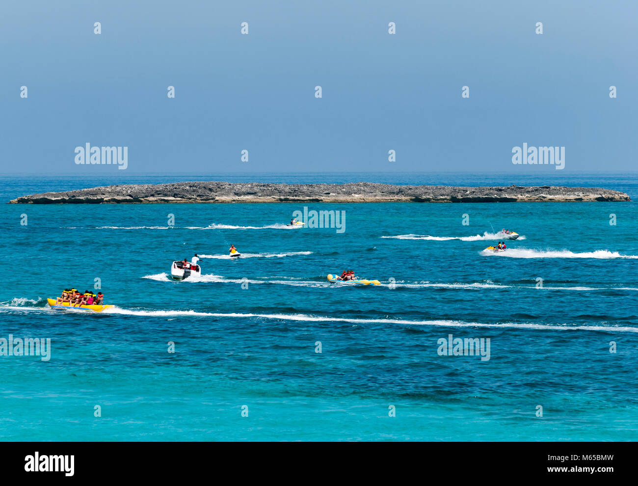 Popular water activities for tourists on Paradise Island beach (Bahamas