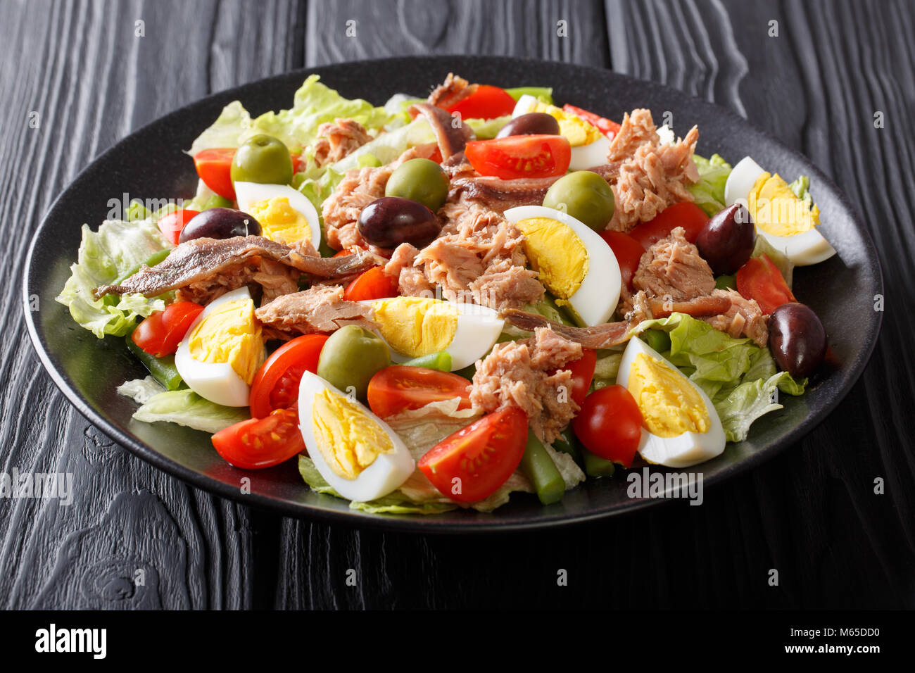 Beautiful tasty traditional nicoise salad with fish tuna and anchovies