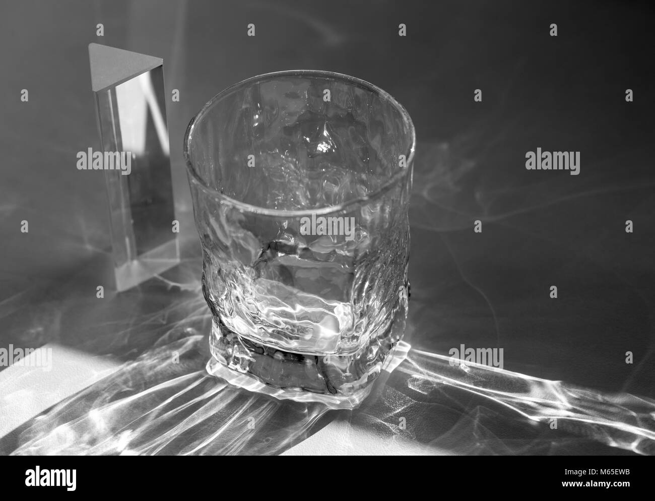 Beautiful caustic effect as light passes through a glass Stock Photo