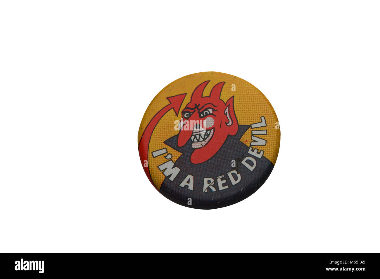 A 1970s era tin badge red Devil lyons ice cream promotional  collectable on a white background. Stock Photo