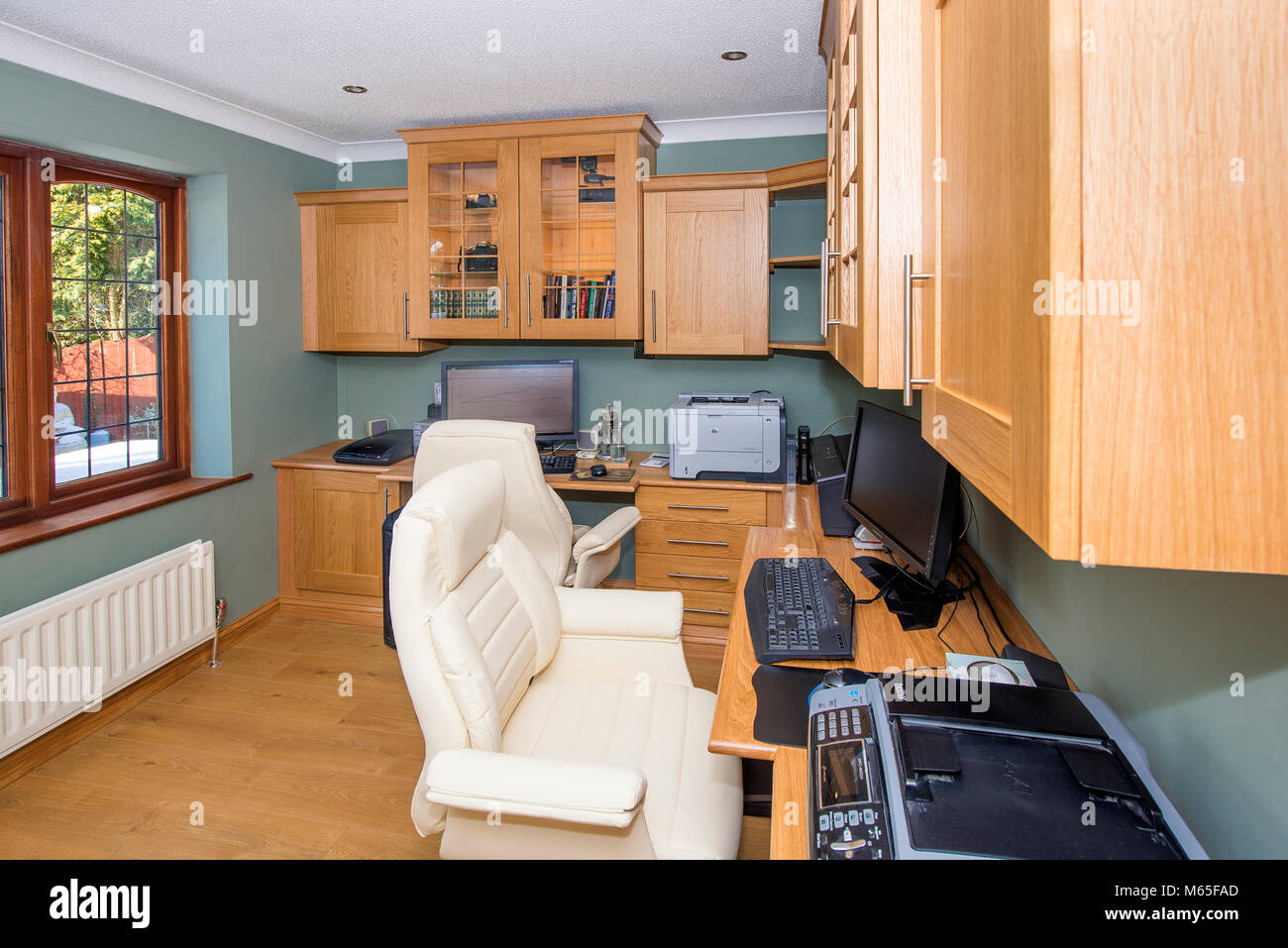 home office or study showing furniture, desks, computers, printers and ...