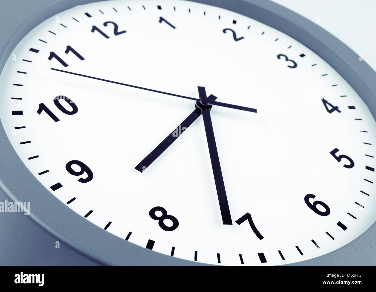 Closeup of hands on clock face Stock Photo Alamy