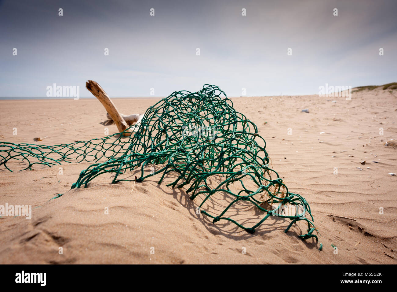 Detritus, plastics and rubbish washed up on Cefn Sidan beach, Pembrey