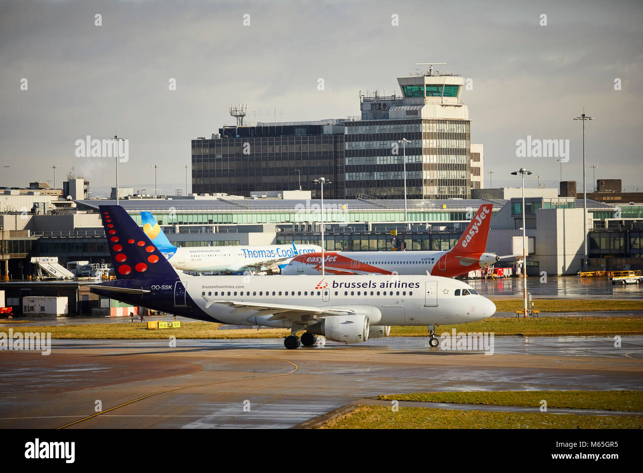 Manchester Airport Brussels Airlines OO-SSK Airbus A319 taxiing before takeoff to Belgium Stock Photo