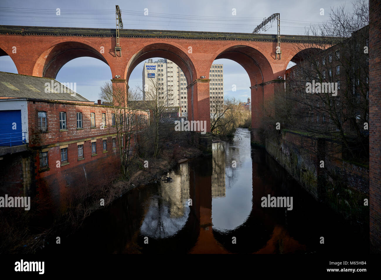 Stockport Viaduct reflecting into the River Mersey, in Stockport Stock