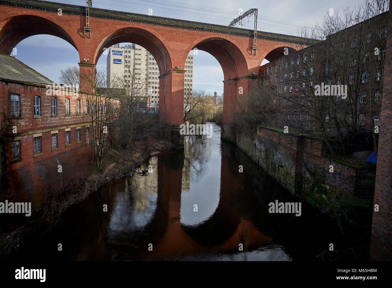 Stockport Viaduct reflecting into the River Mersey, in Stockport Stock Photo