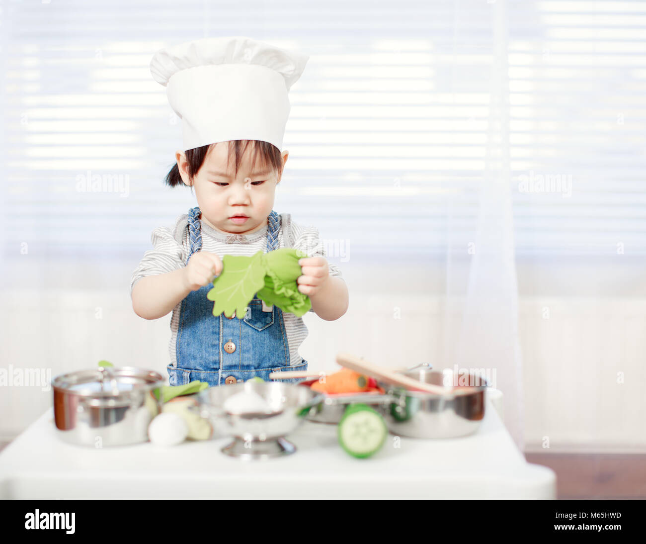 Children pretend cooking hi-res stock photography and images - Alamy