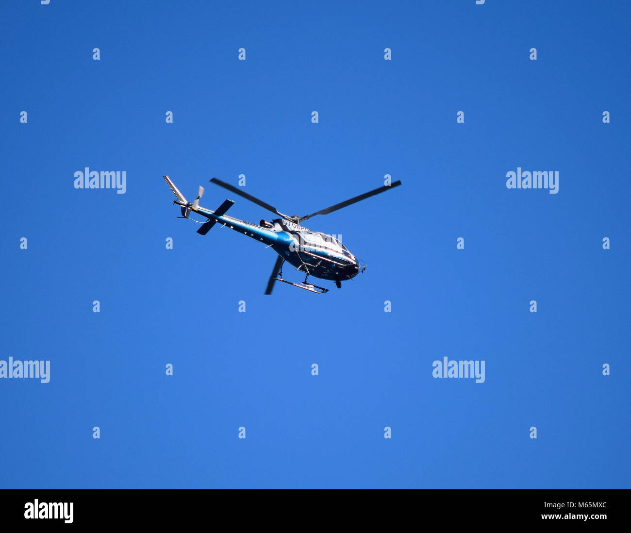 Police helicopter flies hi-res stock photography and images - Alamy