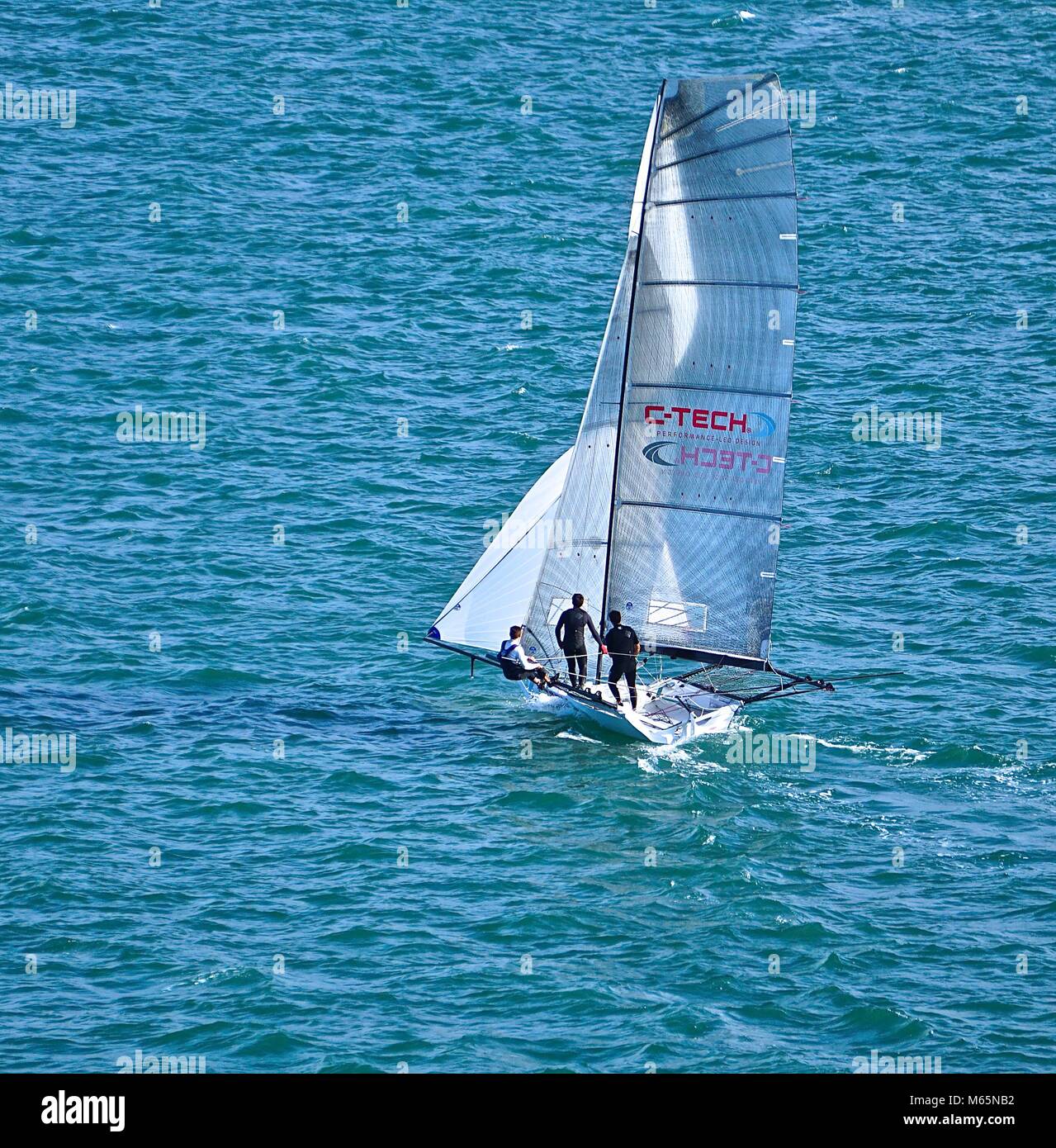 Sail boat navigating a race Stock Photo