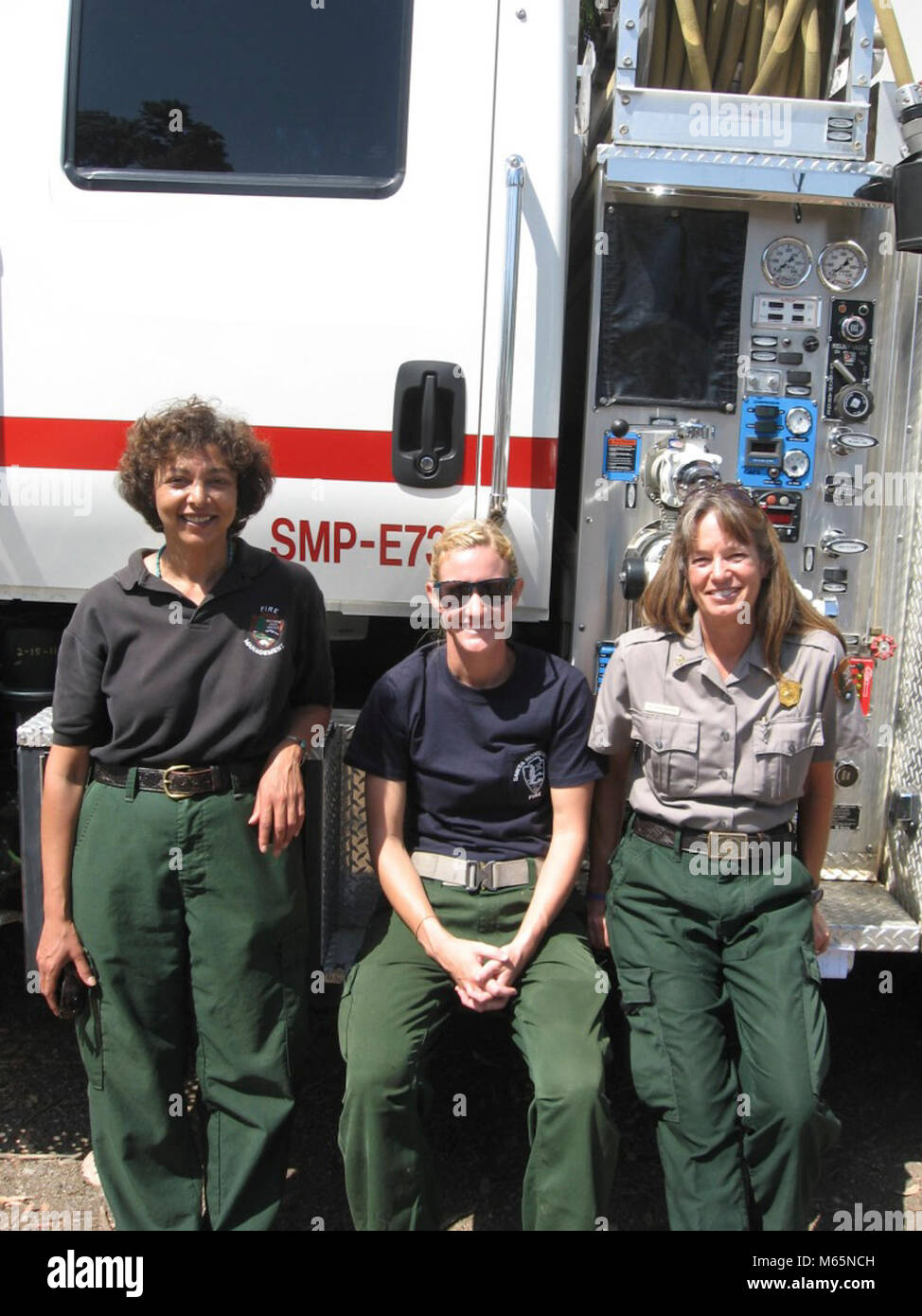 Fire Crew. From L-R: fire program assistant, engine operator, and fire management officer. Stock Photo