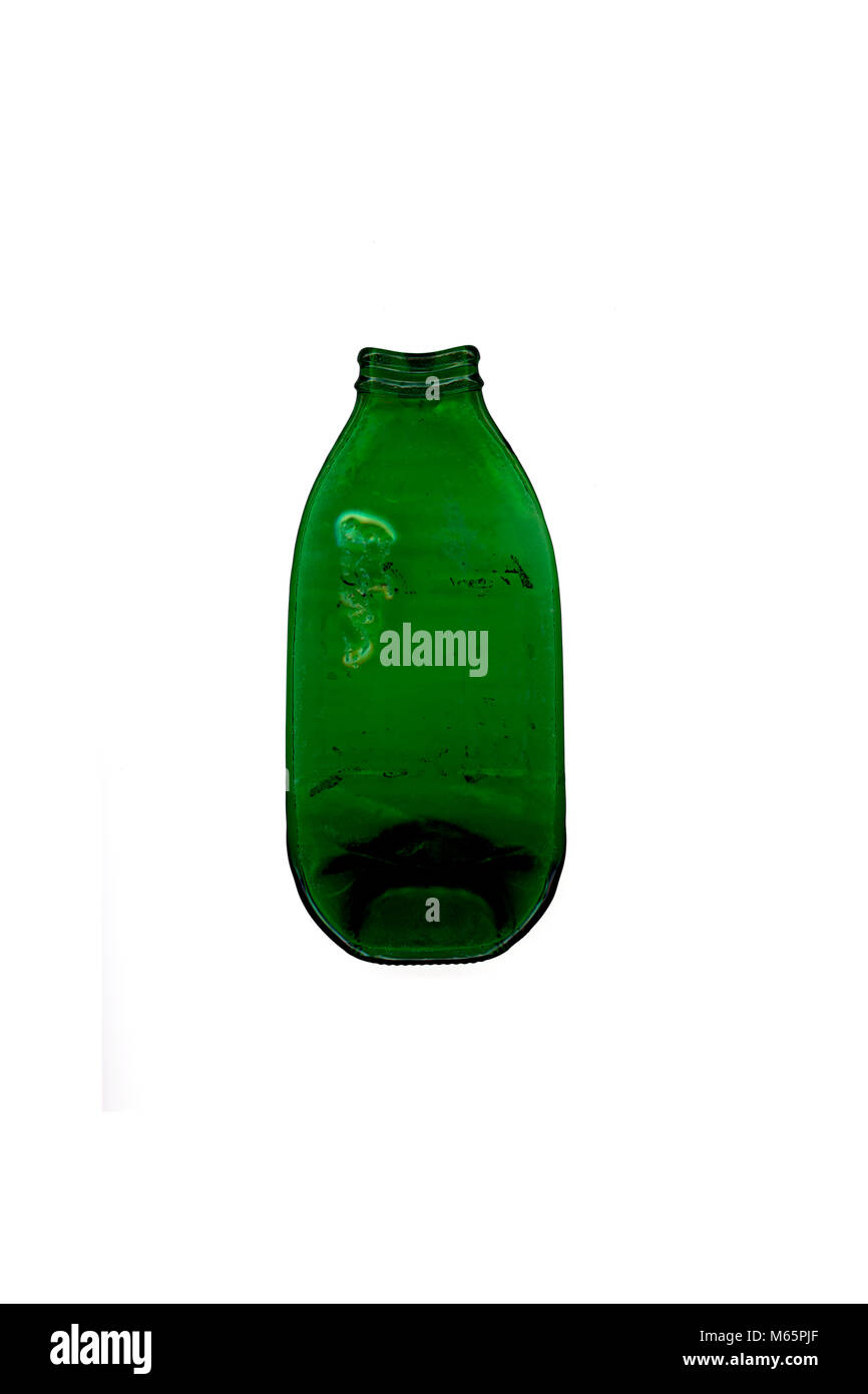 A green pressed glass bottle made of by heating in the oven Stock Photo