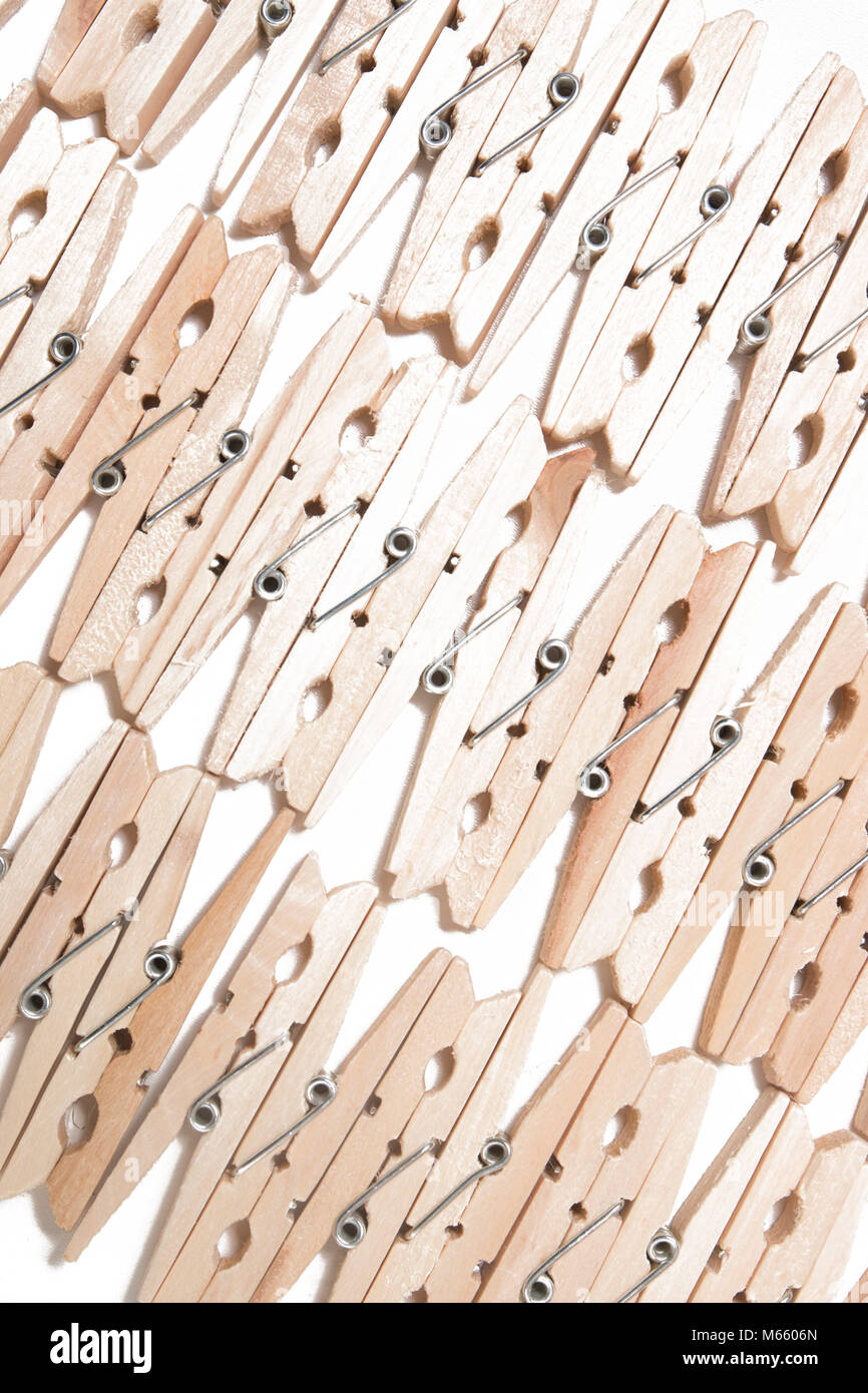 Aligned clothing pegs isolated on a white background Stock Photo Alamy