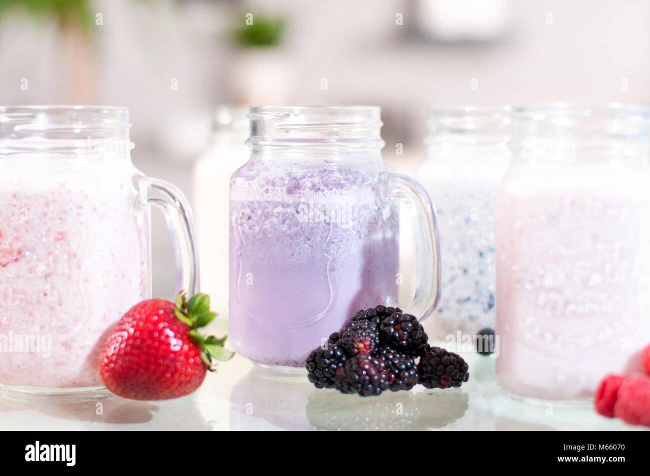 Berry milk smoothie in a glass jar, well being and weight loos concept