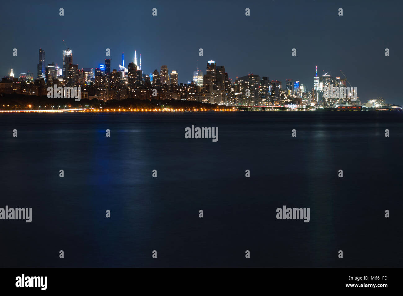 New York City - Panoramic view of Manhattan at night with reflection in ...