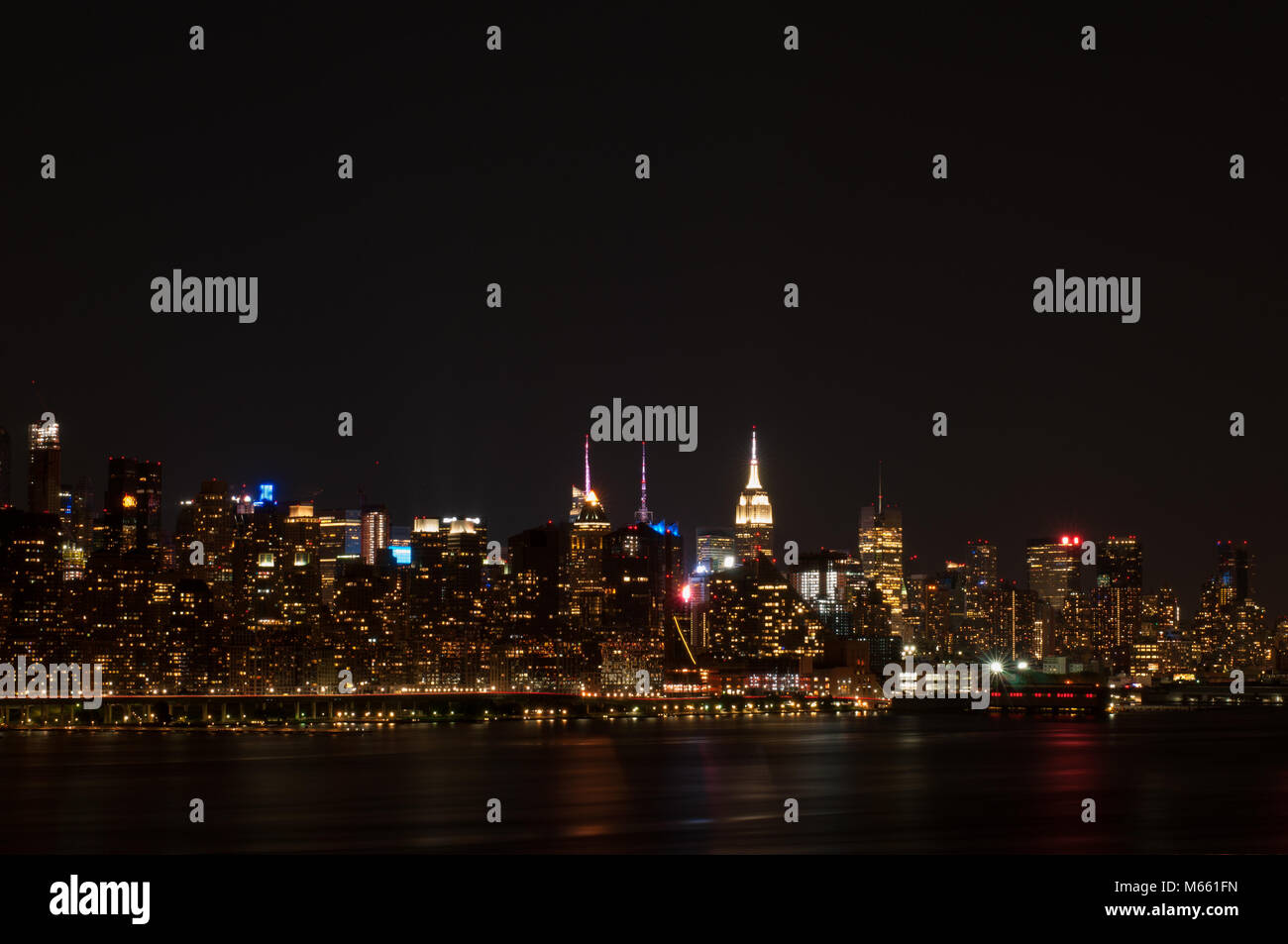 New York City - Panoramic view of Manhattan at night with reflection in ...