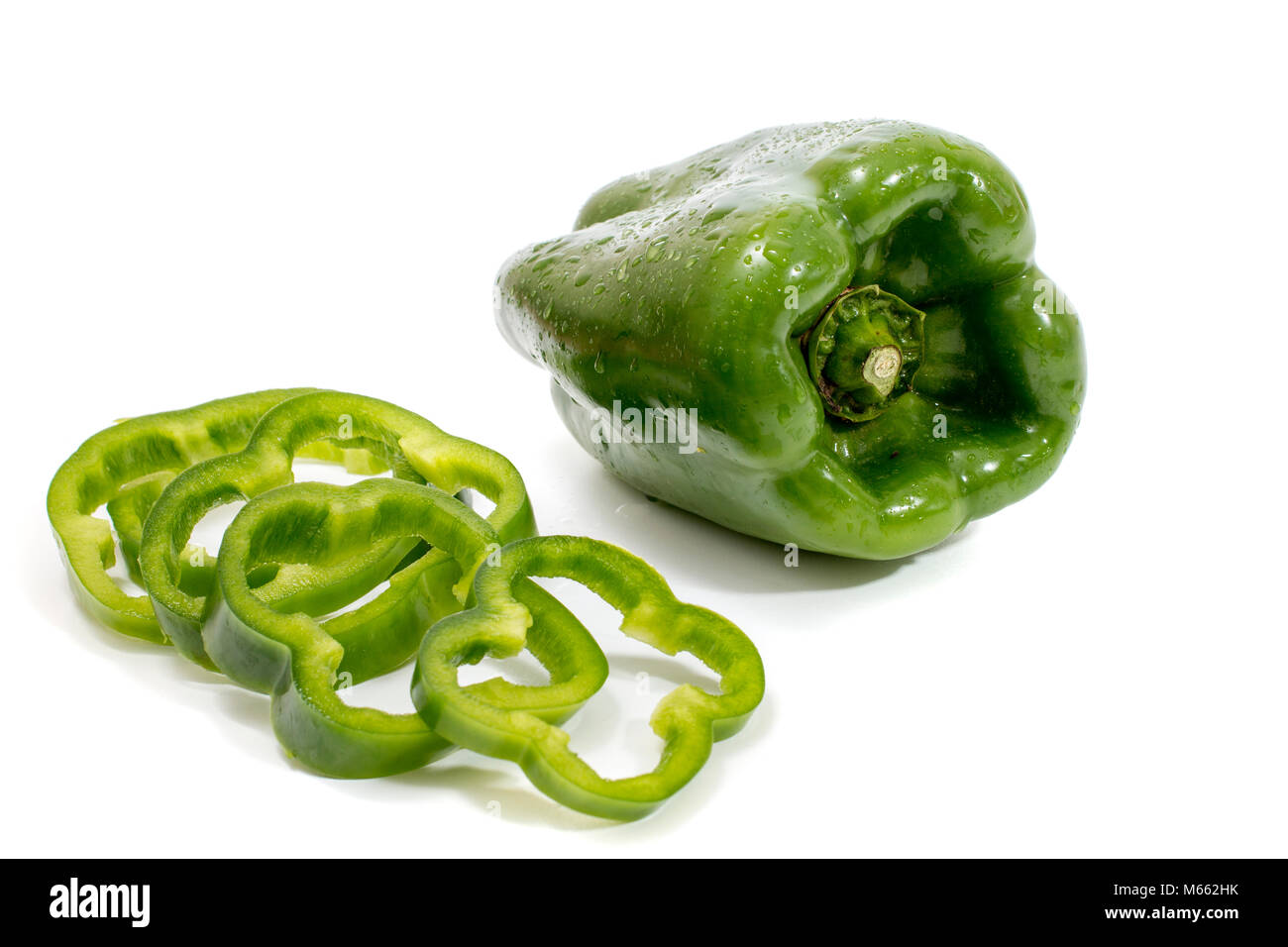 green bell peppers isolated on a white background Stock Photo - Alamy