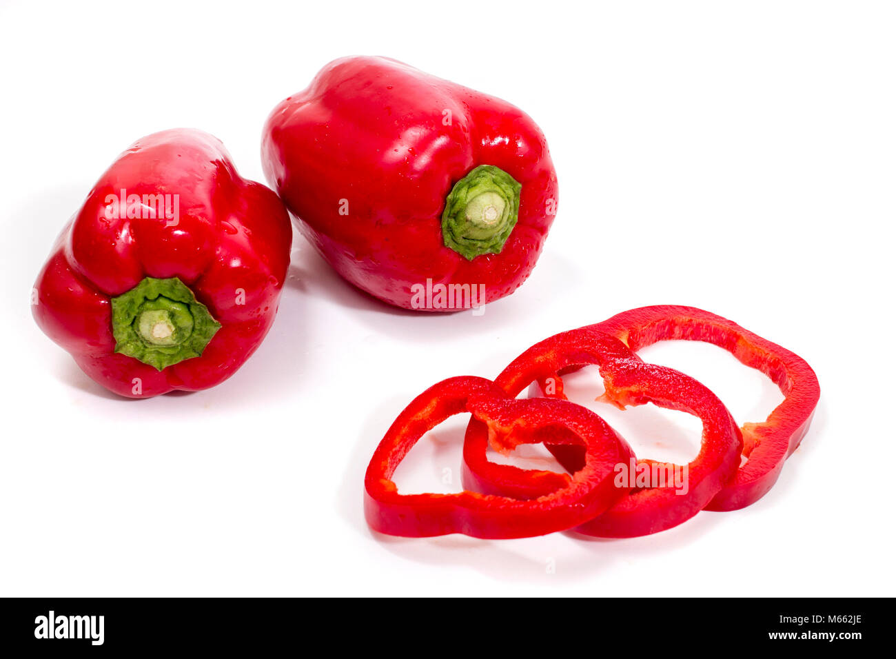 red bell peppers isolated on a white background Stock Photo - Alamy