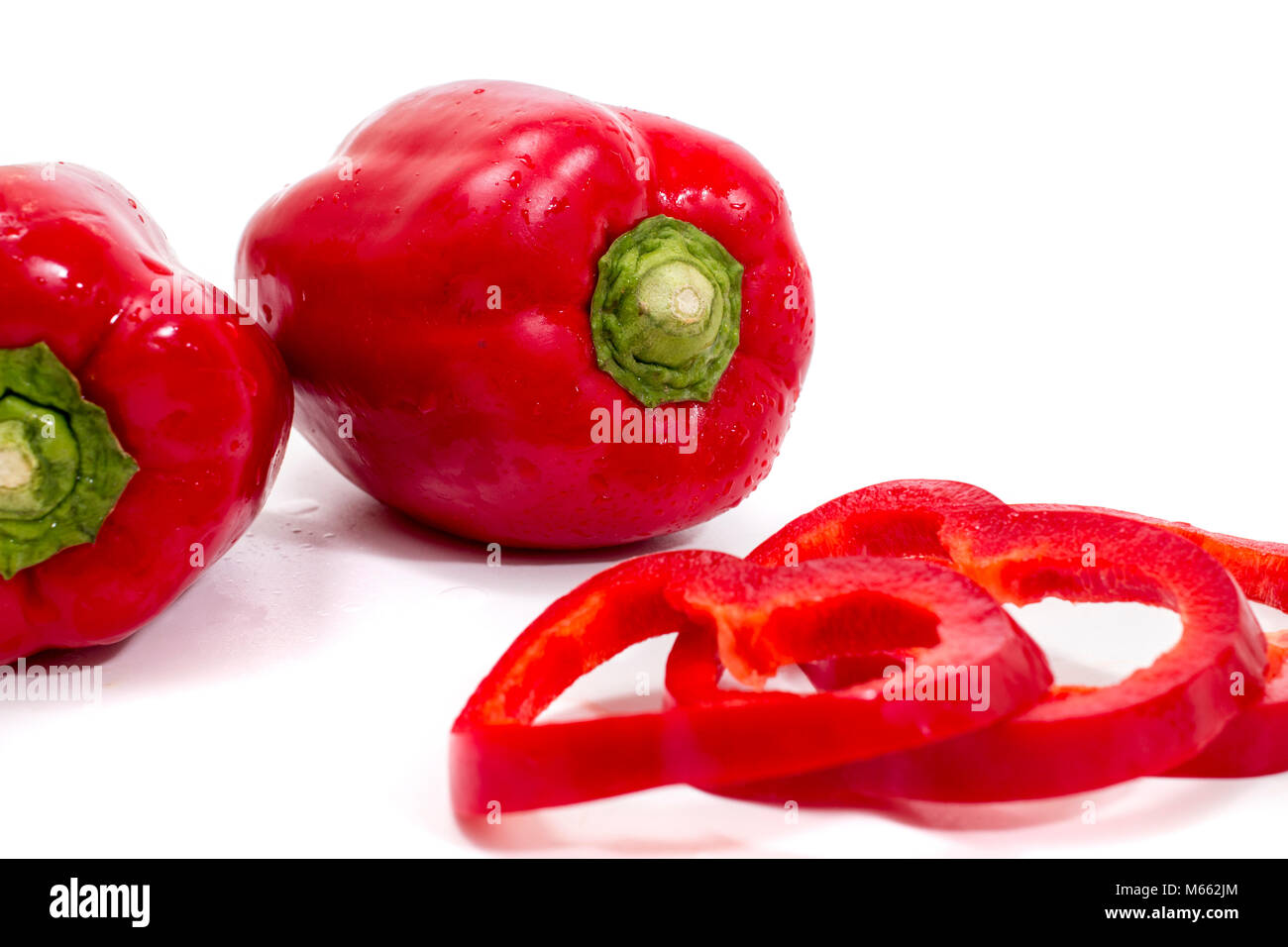 red bell peppers isolated on a white background Stock Photo - Alamy