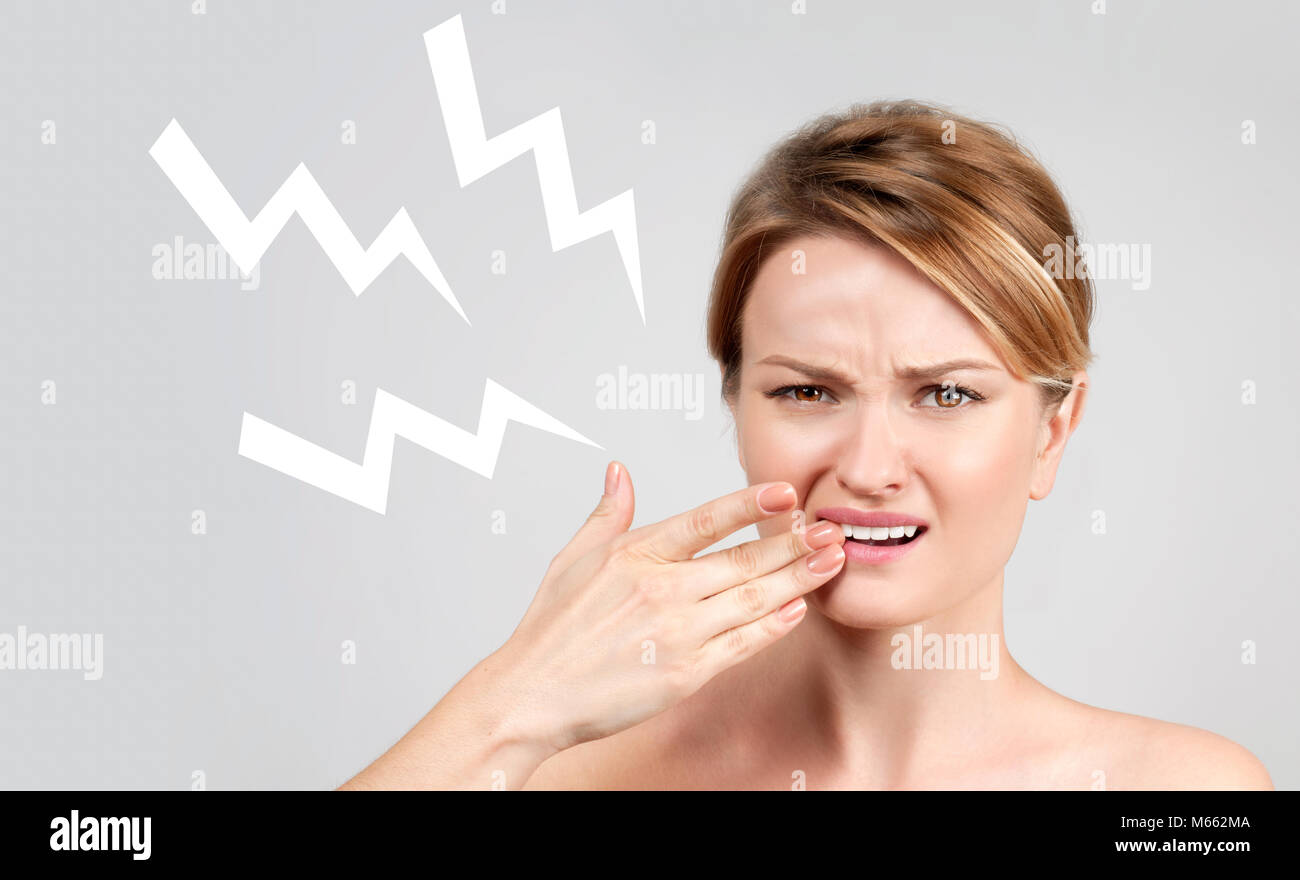 Tooth pain and dentistry, woman feeling strong toothache Stock Photo